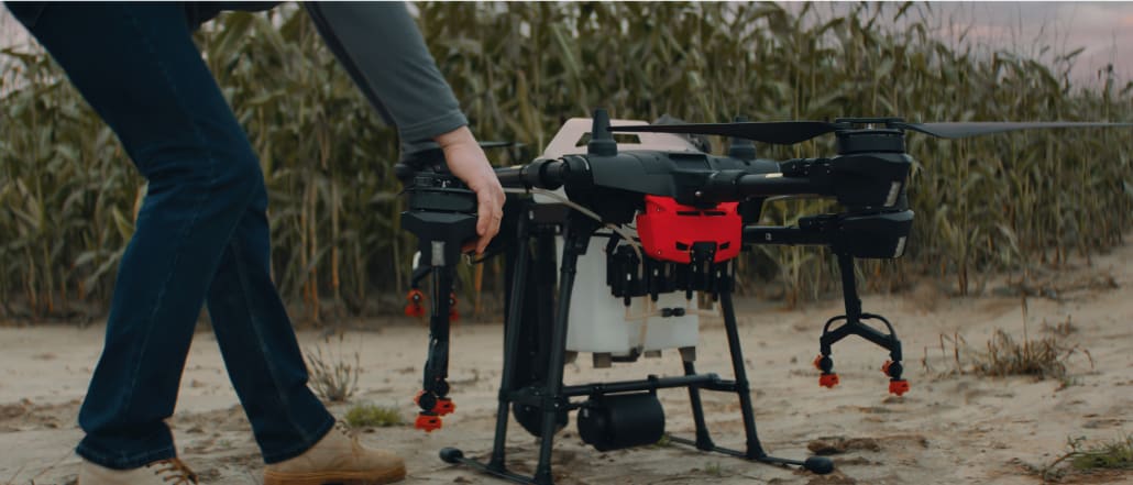 Drone grounded close to what seems to be a corn field